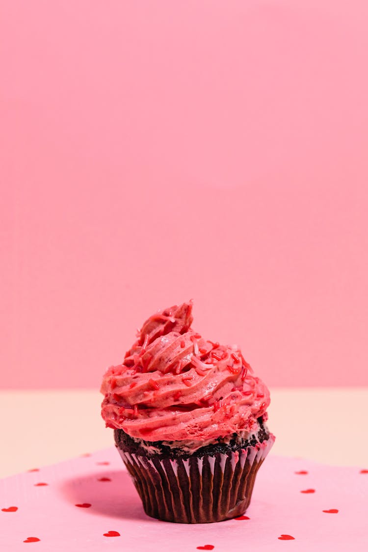 Sweet Red Creamy Cupcake On Pink Background