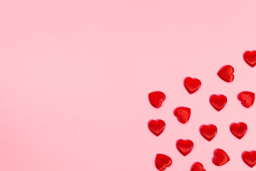 Free Red Hearts on a Pink Background Stock Photo