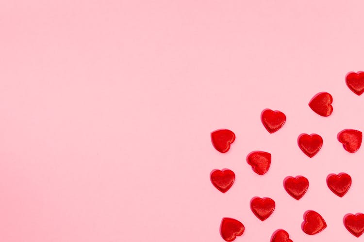 Red Hearts On A Pink Background