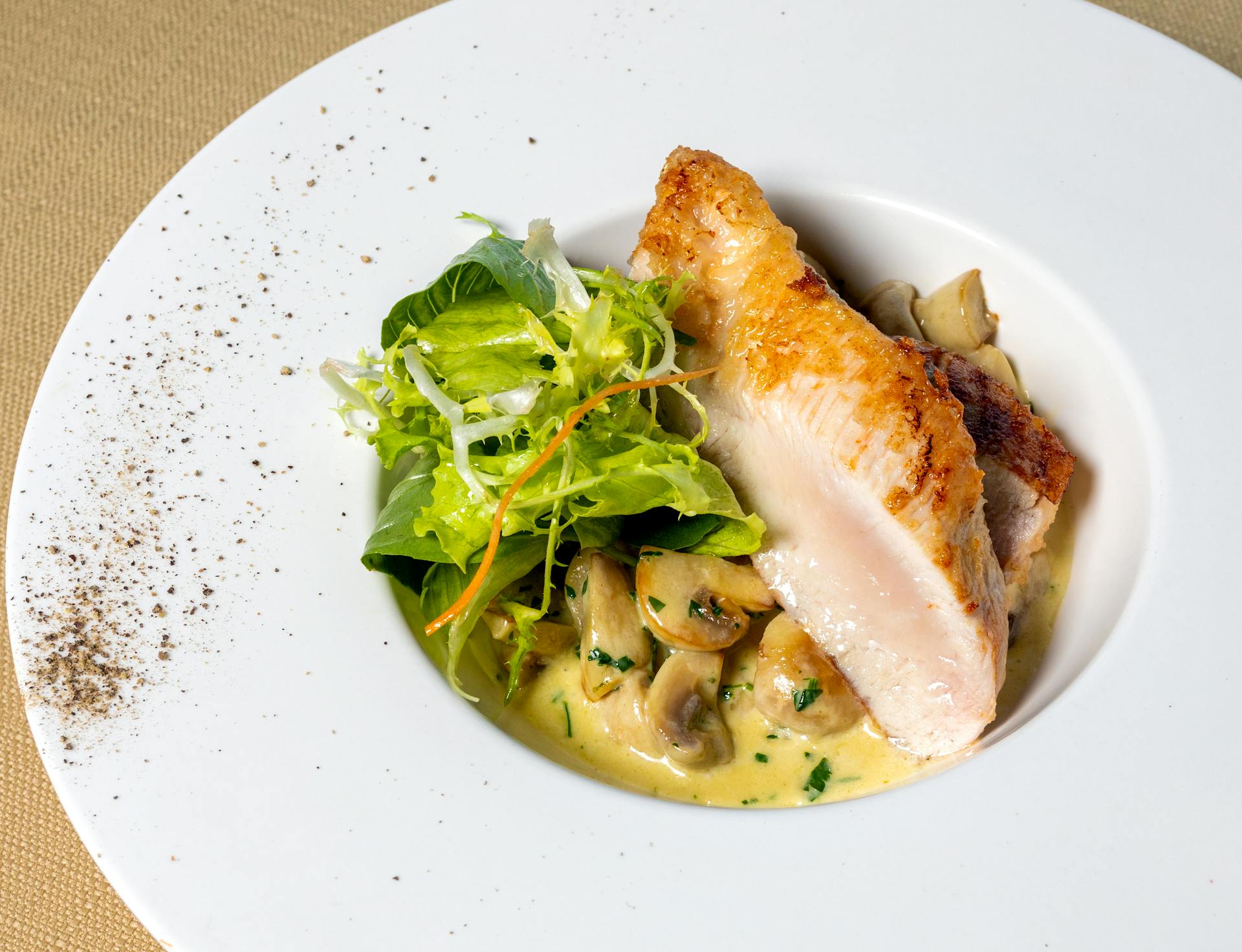 Cooked Chicken and Salad on Creamy Mushrooms