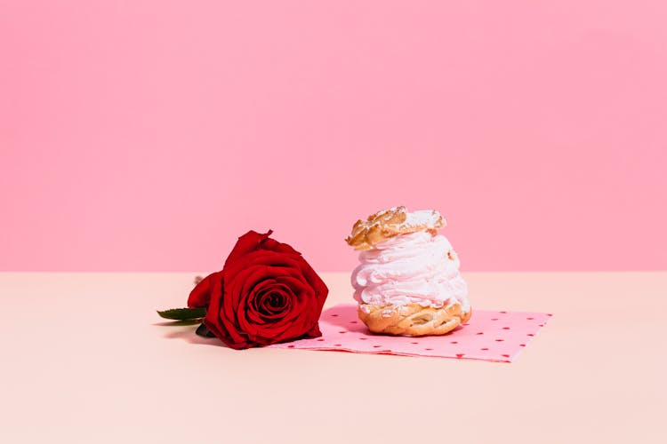 Pink Napoleon Cake And Red Rose On Pink Background