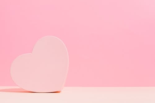 Free Love Heart on a Pink Background Stock Photo