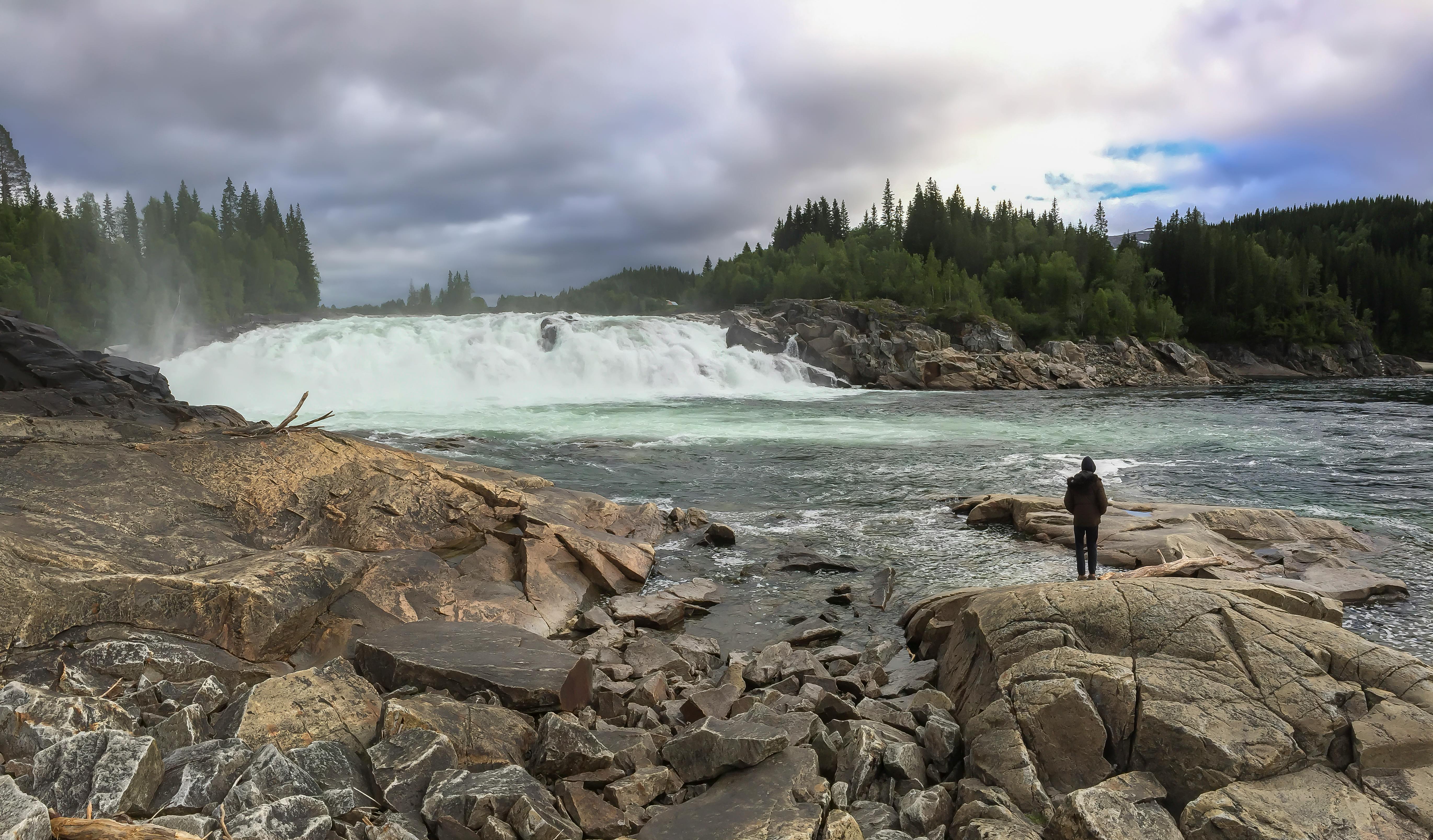 Laksforsen cascade in Grane municipality in Nordland Province in Norway  running over some 17 meter high cascades over a rocky stretch Stock Photo -  Alamy