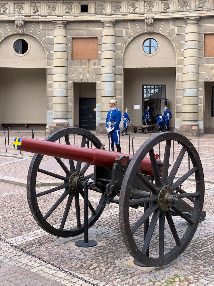 Antique Cannon And Honor Guards In Front Of The Royal Palace In Stockholm