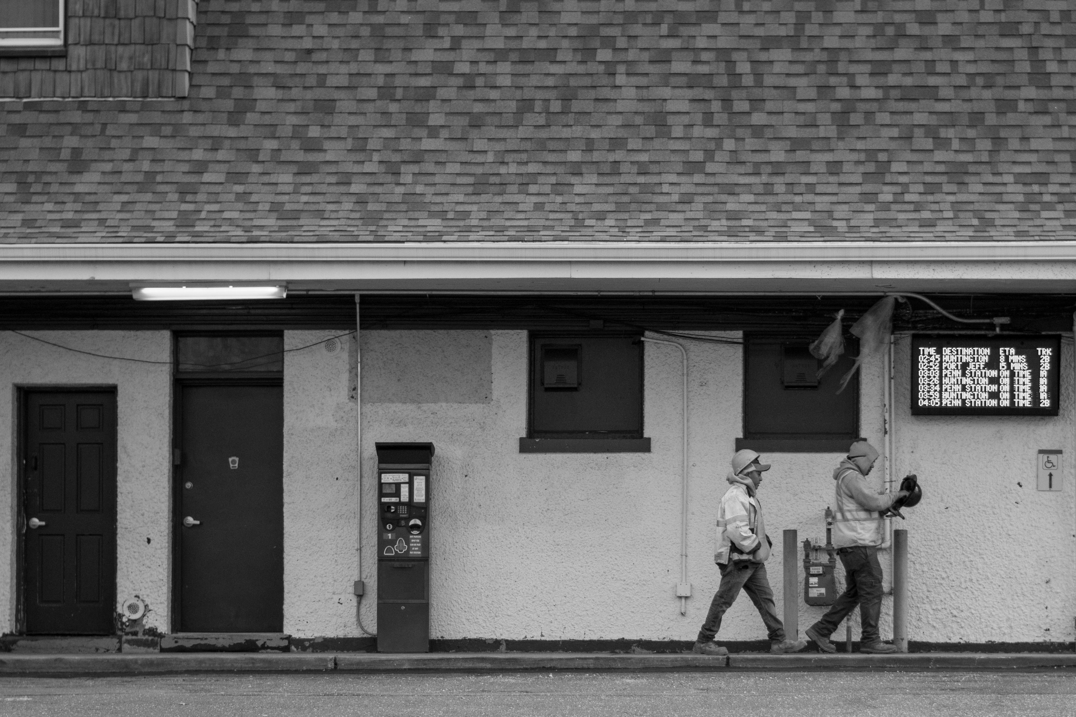 Grayscale Photo of Two Men Walking Together on the Sidewalk · Free ...