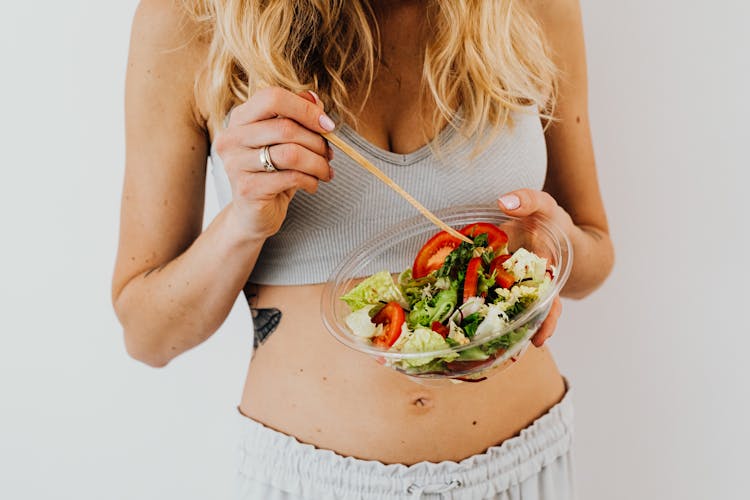 Woman Eating A Salad 