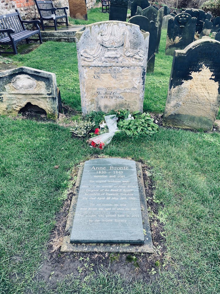 Tomb Stones On Green Grass Field