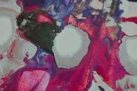Top view background of fabric with creative design of blue pink and white splotchy stains