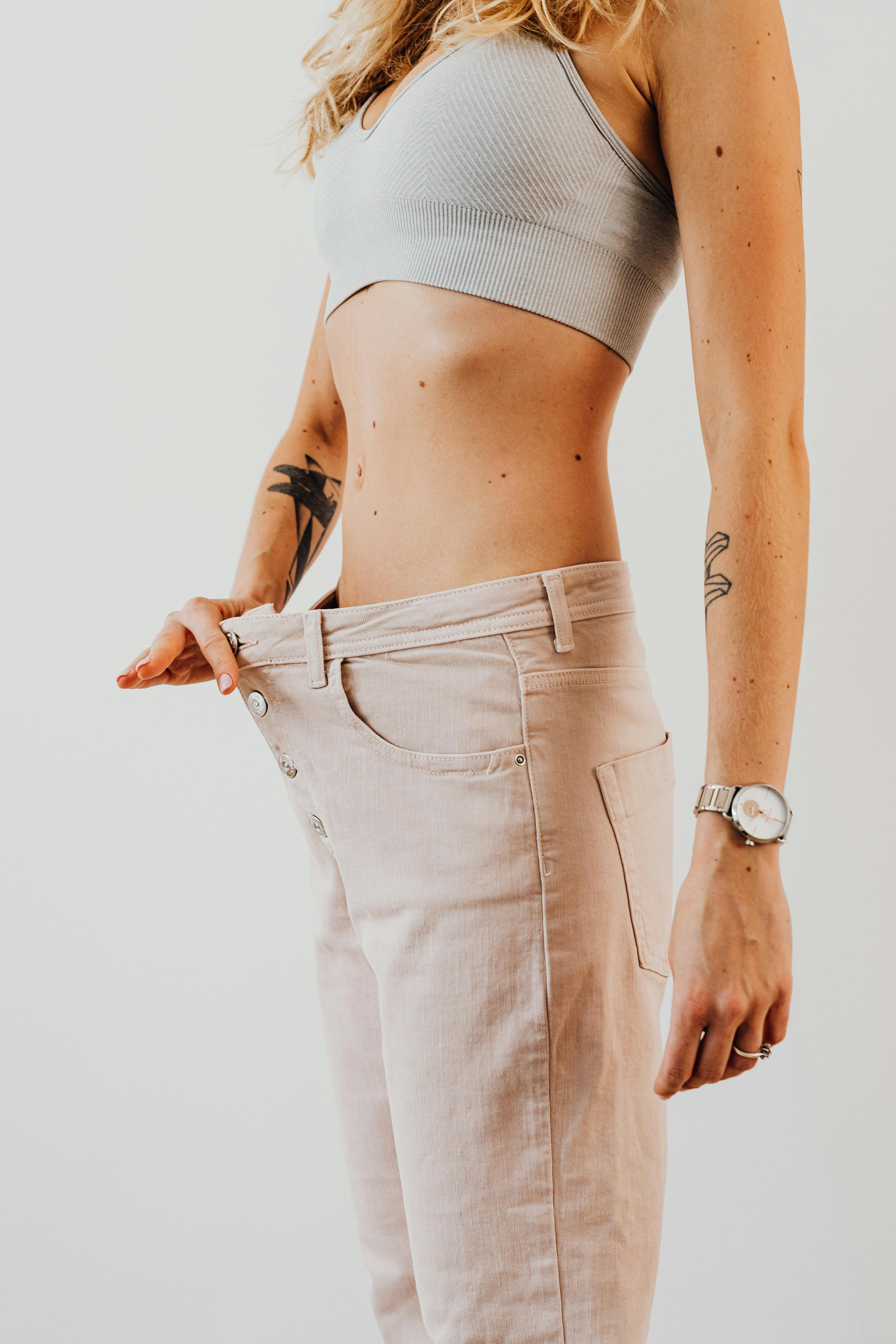 Woman Wearing Loose Pants after Weight Loss · Free Stock Photo