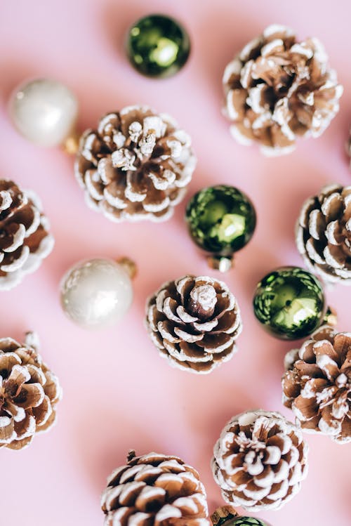 Free Close-Up Shot of Christmas Ornaments on Pink Surface Stock Photo