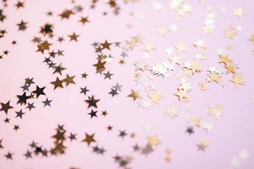 Close-Up Shot of Stars on Pink Surface