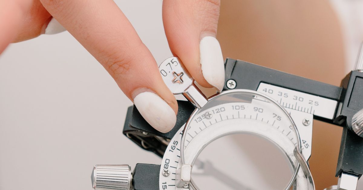 Face Less Lens Crop faceless female optometrist adjusting lens on trial frame · Free ...
