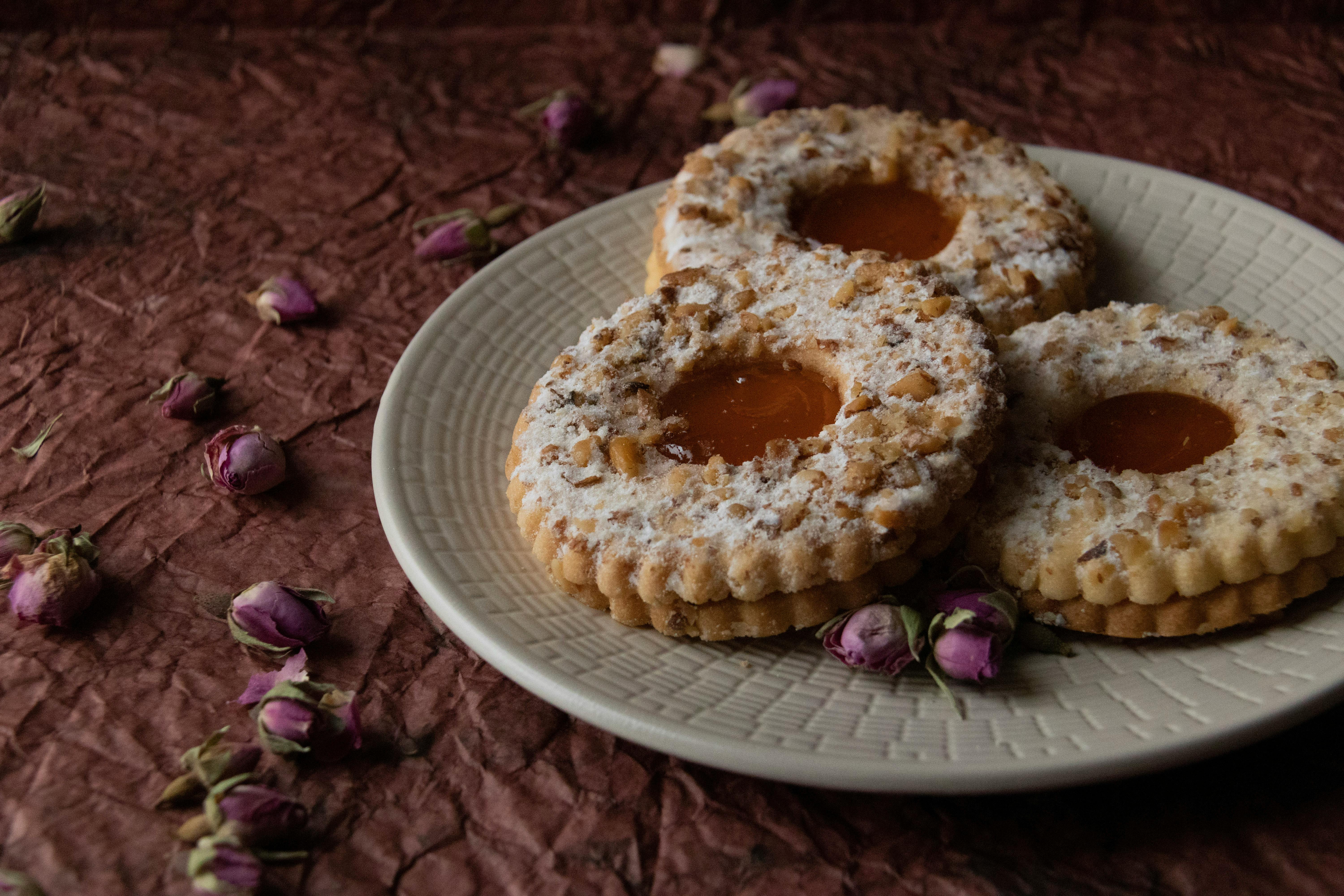 Stressed remote worker sitting at a desk with multiple devices and notifications
