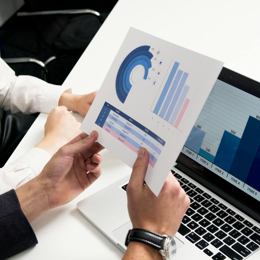 People reviewing marketing charts, highlighting data and analysis.