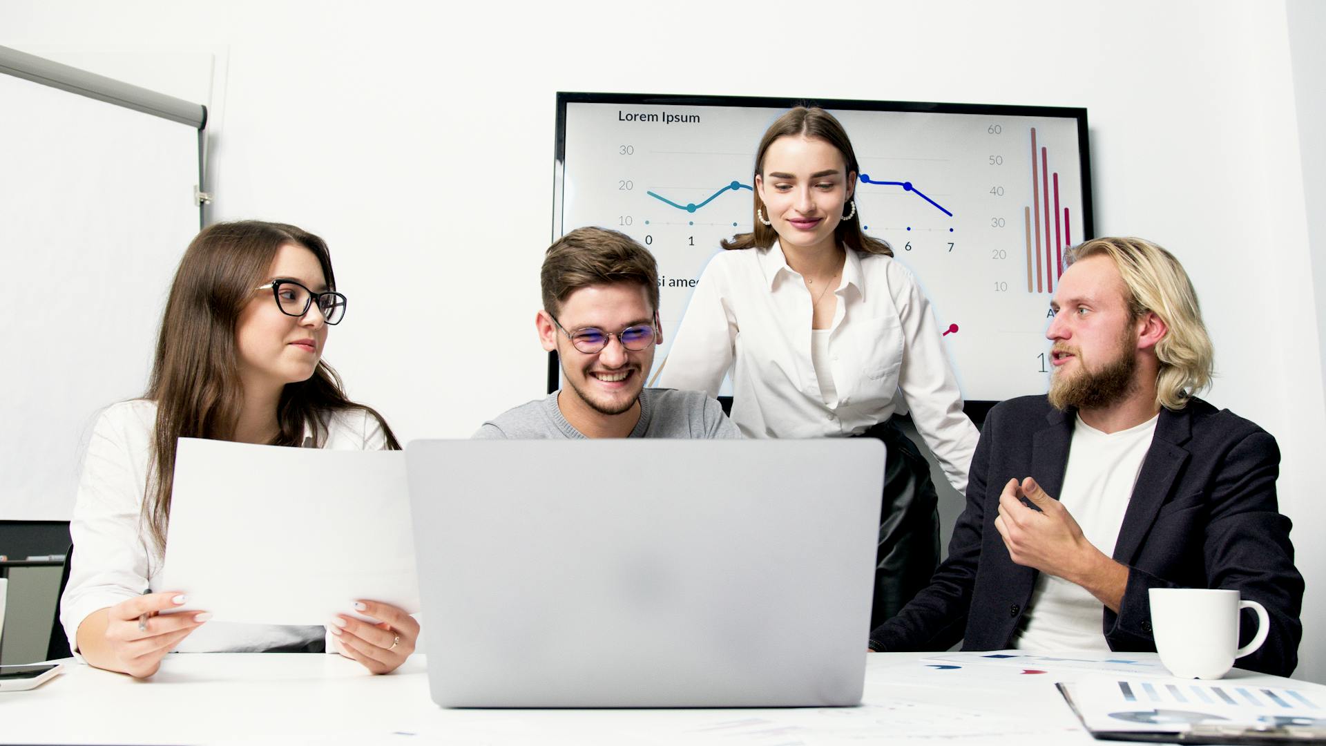 2 Women and Man Sitting Beside Table With Laptop Computers