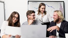 A Team Smiling While Working