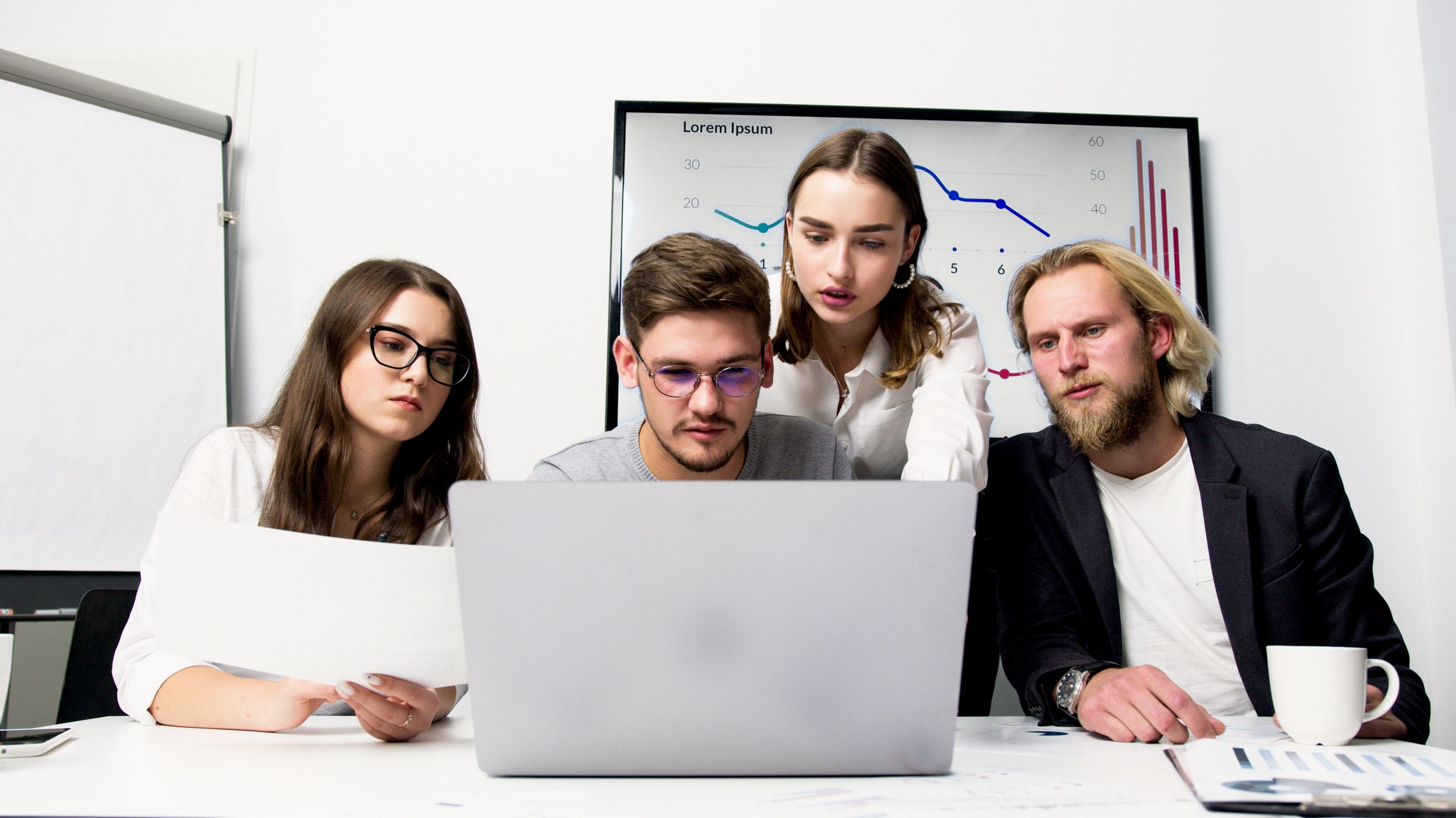 Professional reviewing sales data on a computer screen