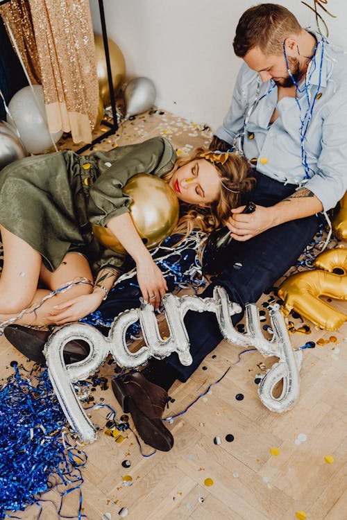 Free Man and Woman Sleeping after Party Stock Photo
