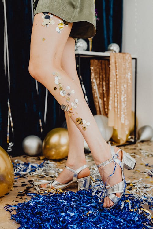 Balloons on Floor Near Woman Legs