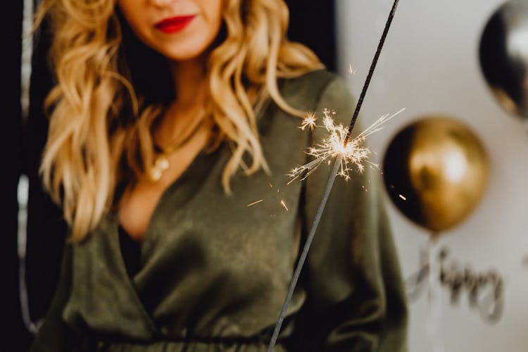 Woman Holding Sparkling Firework