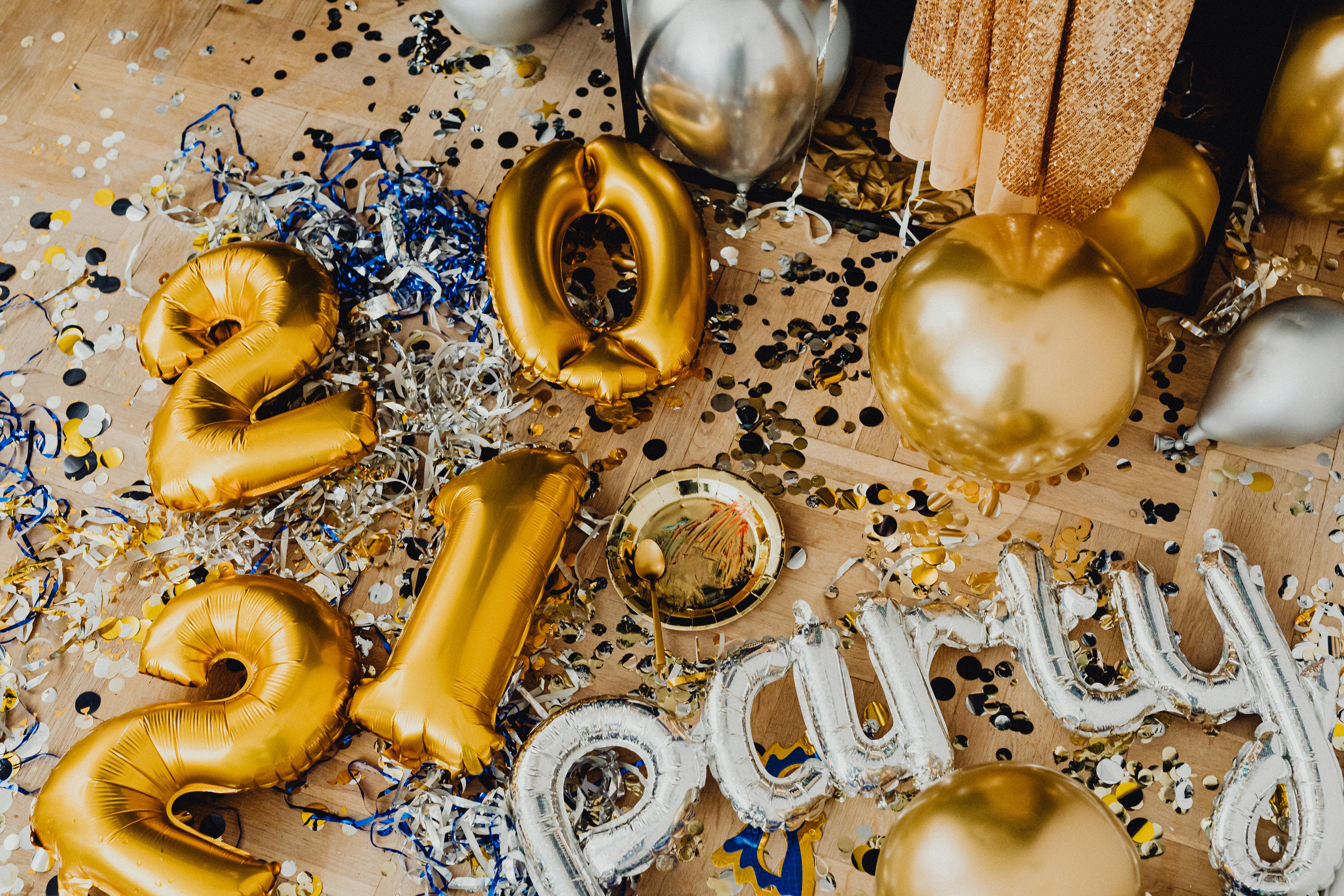 a gold and silver balloons scattered on the floor