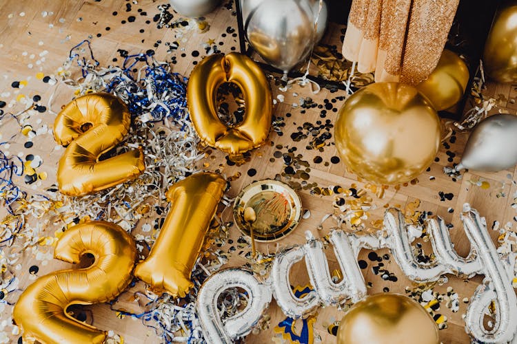 A Gold And Silver Balloons Scattered On The Floor