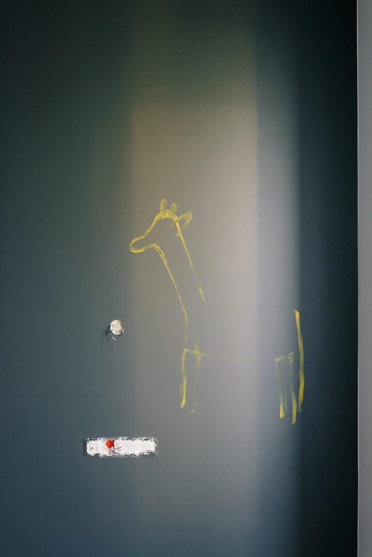 Dark Wall With Painted Yellow Animal