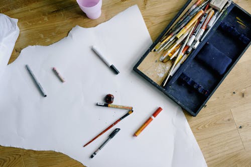 Set of painting tools scattered on floor