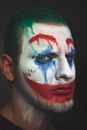 Man wearing Halloween makeup of clown