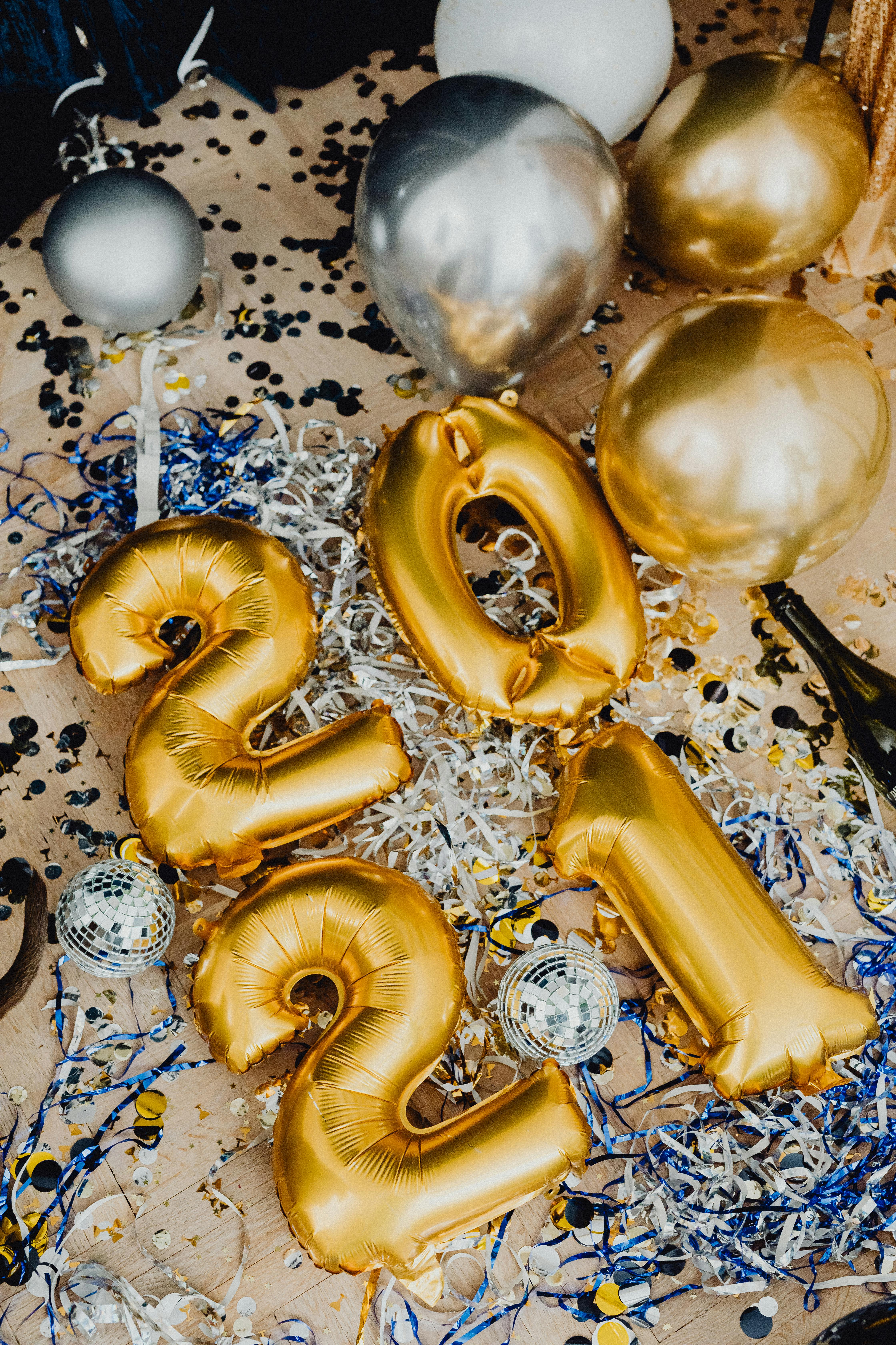 a gold and silver balloons on the floor