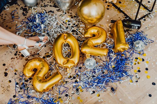 Balloons on Floor Near Woman Legs