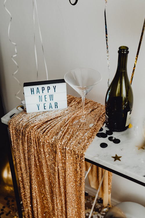 Free Champagne and Happy New Years Note on Table Stock Photo