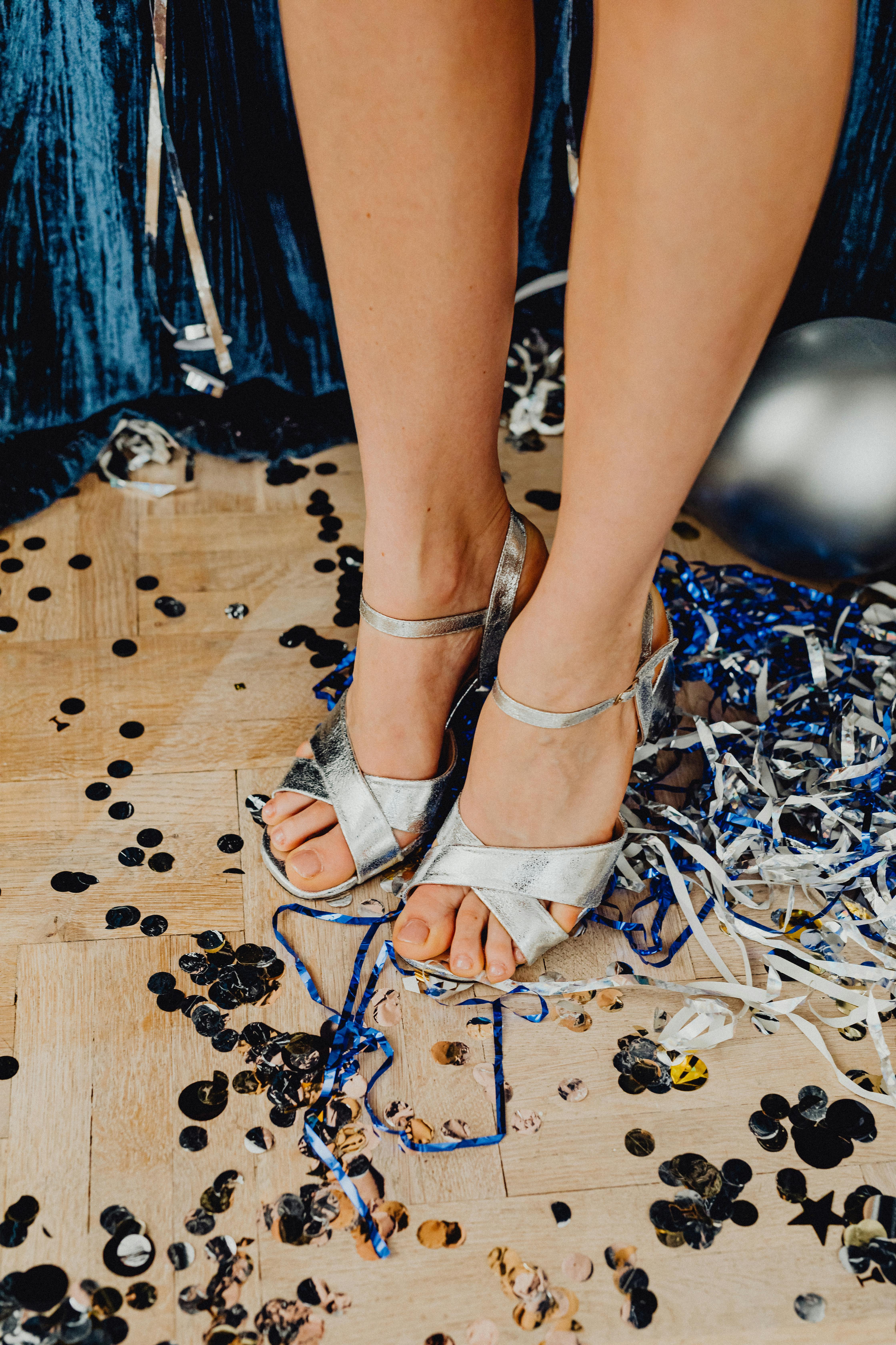 person in silver peep toe sandals