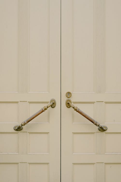 Free White wooden door with metal handles Stock Photo