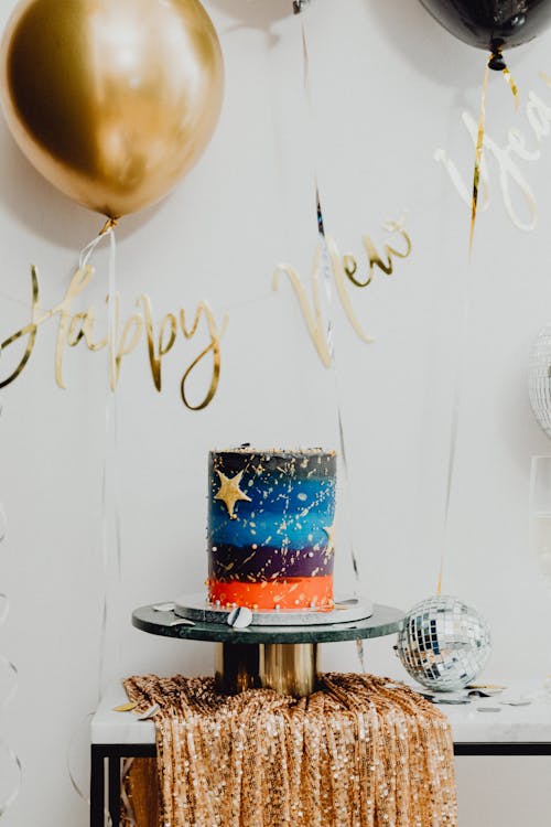Free Cake Under the Hanging Balloons  Stock Photo