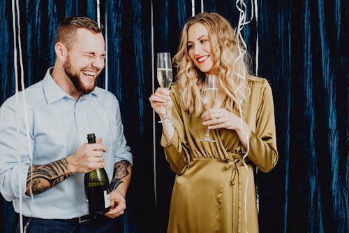 Man and Woman Having Fun Drinking Champagne