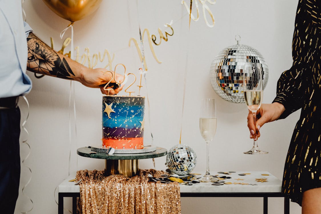 Free Person Lighting the Number Candles on Top of the Cake  Stock Photo