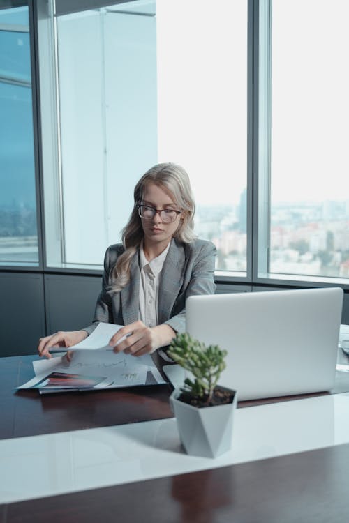 Free Woman Sitting in Front of a Laptop Computer Stock Photo