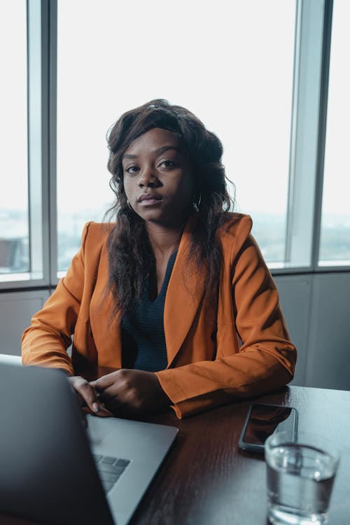 A Businesswoman in an Orange Blazer