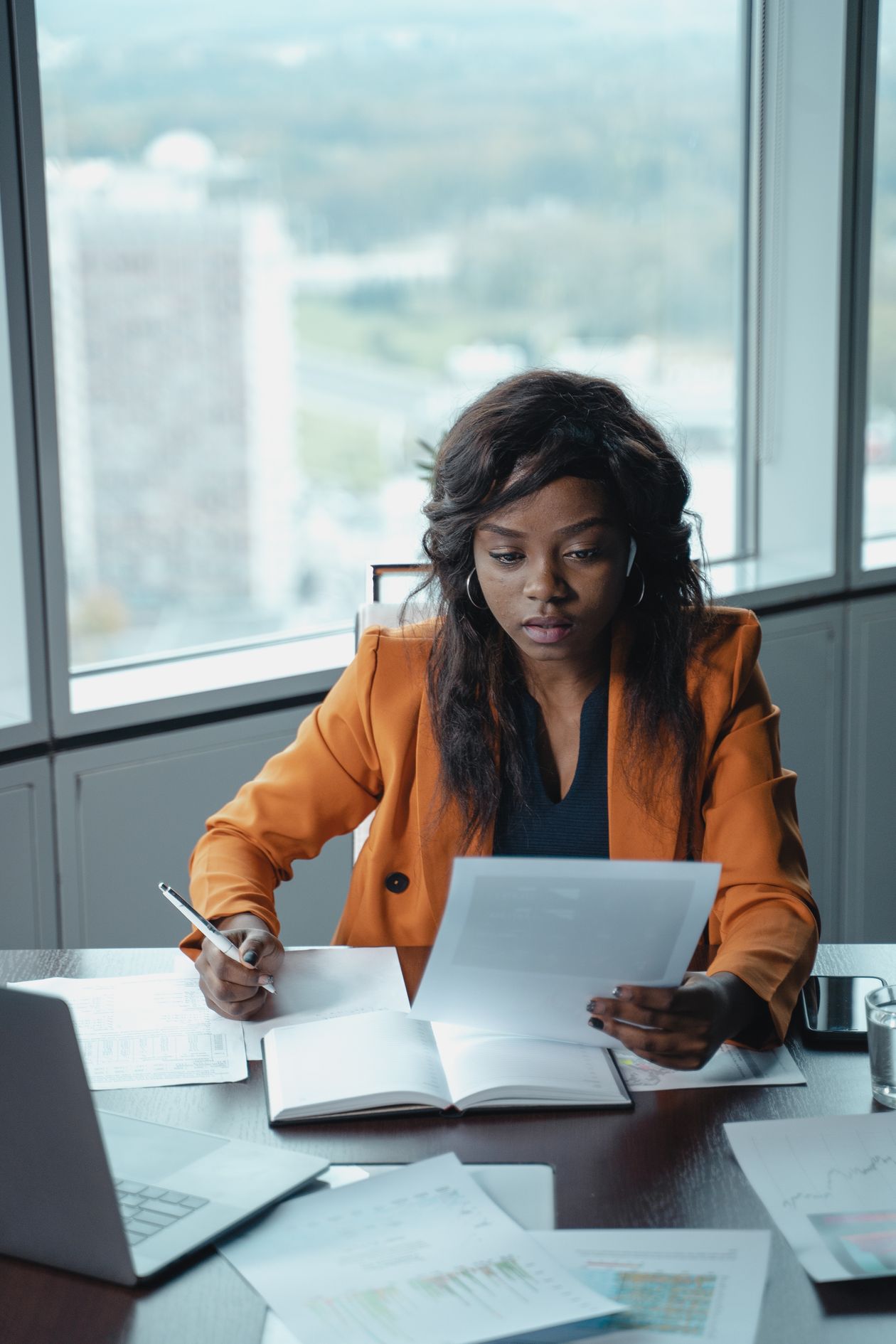 An African woman working focused at her desk in a modern office