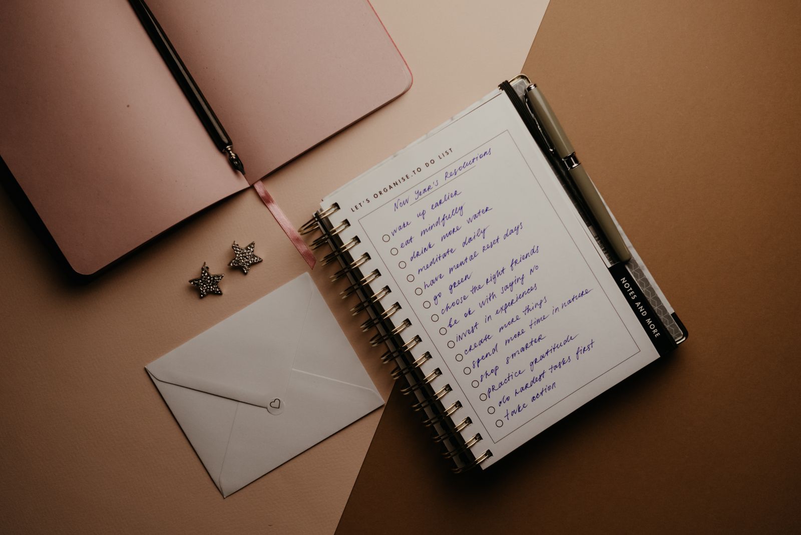 Notebook page with SMART fitness goals being written out
