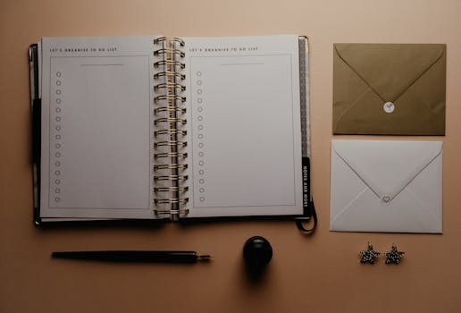 Flat lay of a to-do list notebook and envelopes, perfect for planning and organizing.