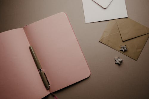 Pink Notebook on the Table