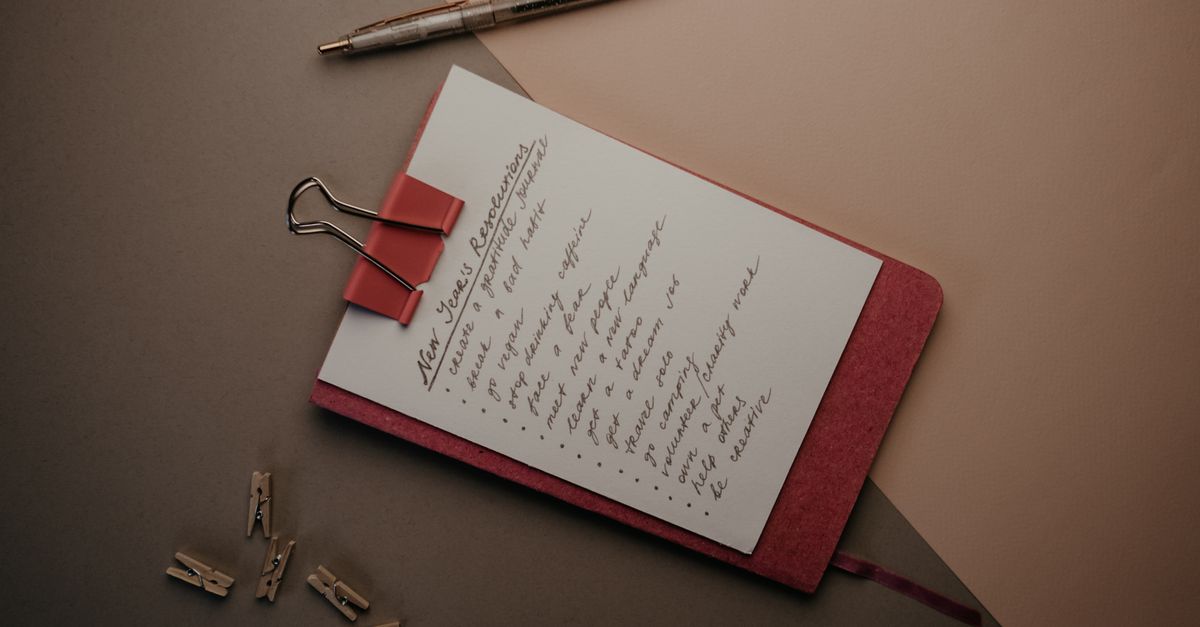 a handwritten to-do list on nice paper next to a pen, aesthetically pleasing
