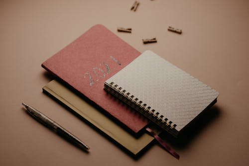 Free Assorted Notebooks on the Table Stock Photo