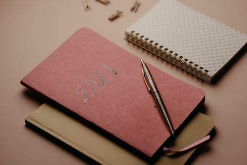 Assorted Notebooks on the Table