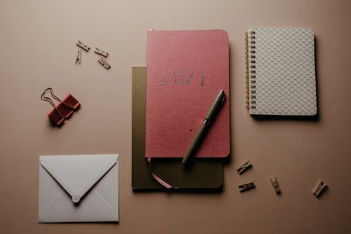 Assorted Notebooks on the Table