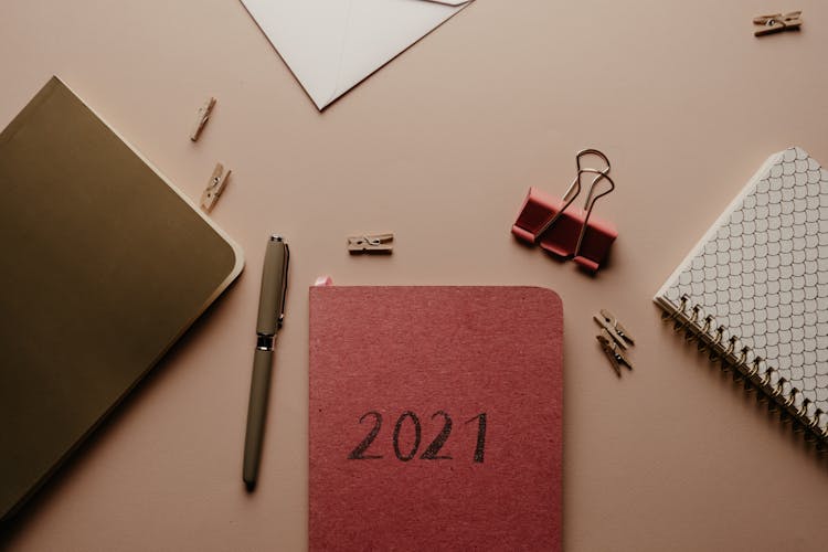 2021 Pink Organizer With Office Supplies On Table