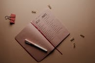 Pink Notebook on the Table