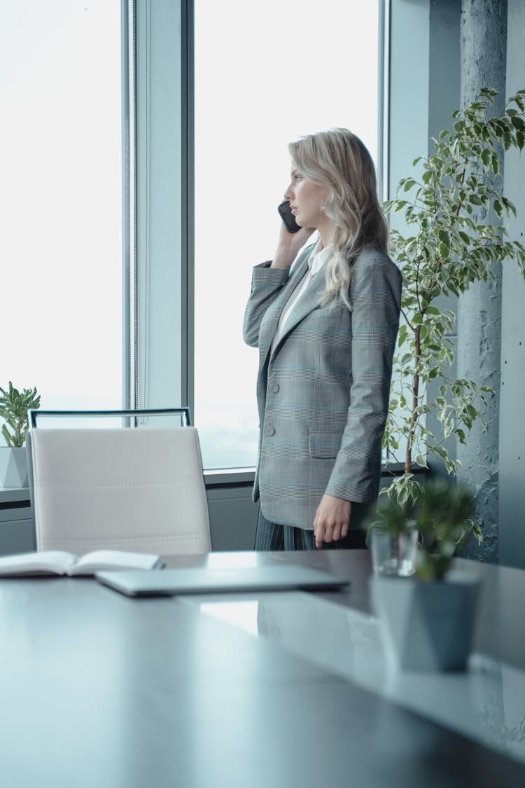 Woman In Gray Blazer On The Phone